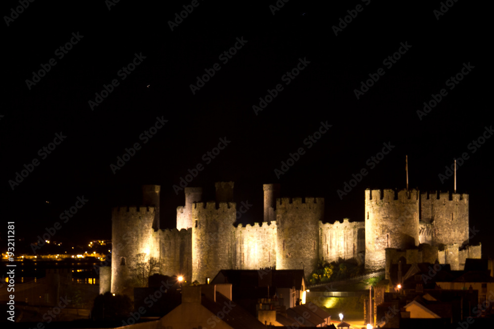 Majestic, medieval Conwy Castle illuminated at night