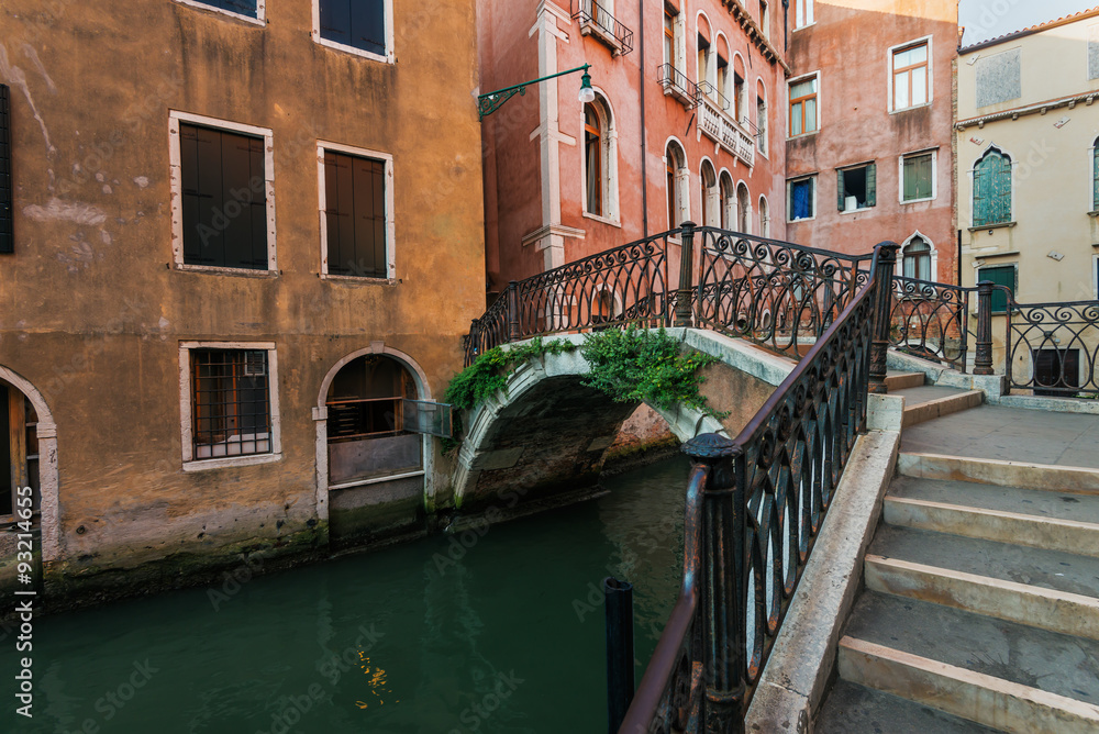 Narrow canal among old  houses, Venice, Italy.