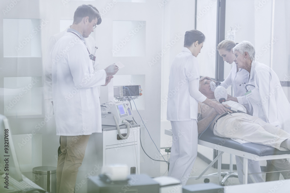 Hospital staff helping patient in emergency Hospital staff helping patient in emergency