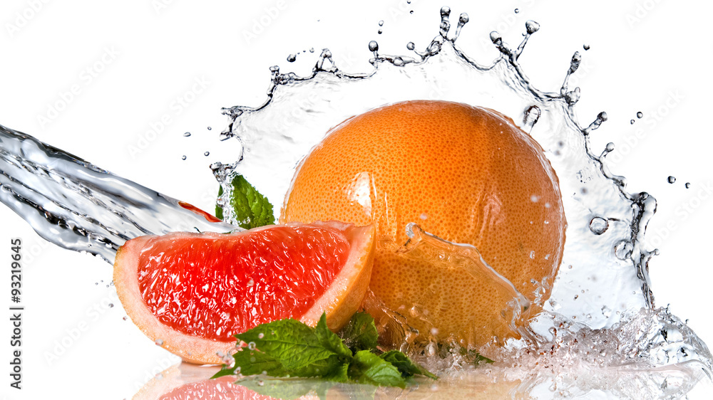 Water splash on grapefruit with mint isolated