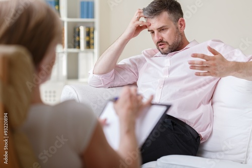 Businessman on psychotherapy session photo