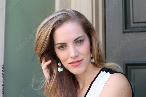 Vászonkép Portrait of naturally beautiful woman in her twenties with blond hair and blue e