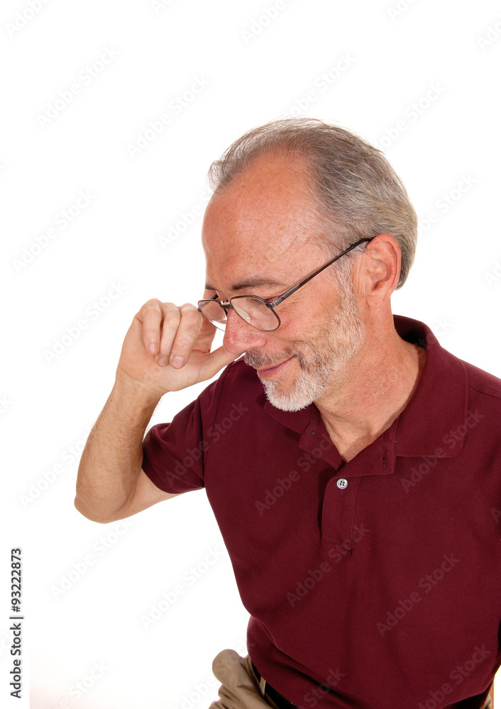 Obraz premium Older mal looking down in portrait.