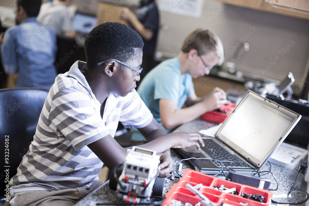 Schoolboys with laptop in robotics class Schoolboys with laptop in robotics class