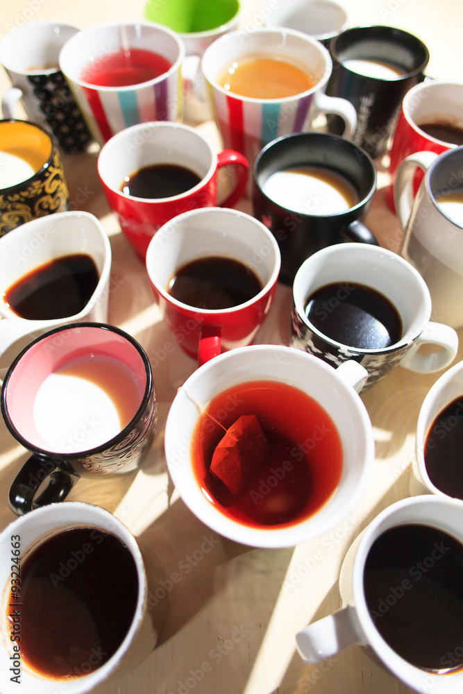 tea, coffee and milk in cups from above tea, coffee and milk in cups from above