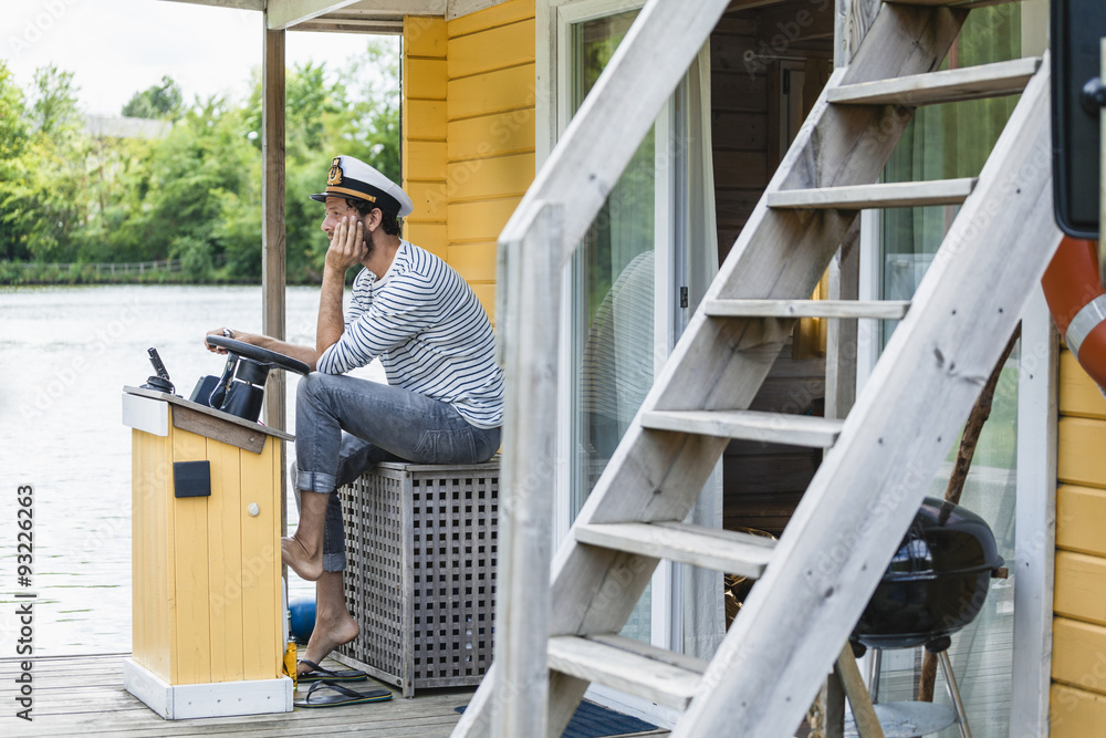 custom made wallpaper toronto digitalMan wearing captain's hat having a trip on a house boat