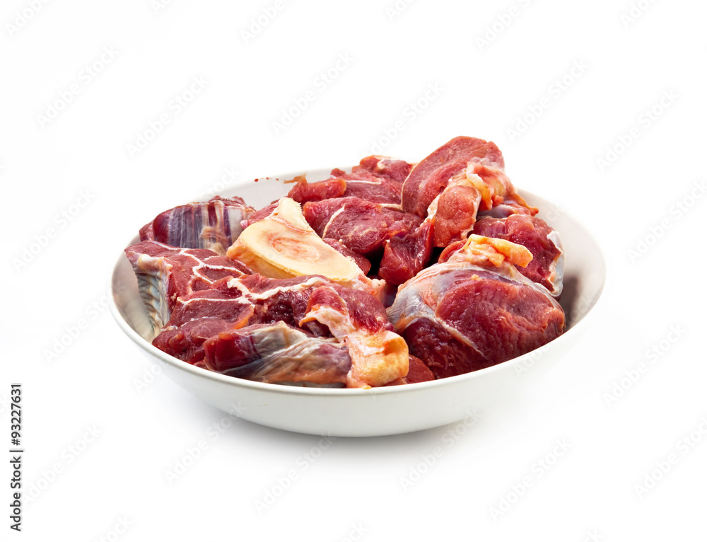 red raw meat over white