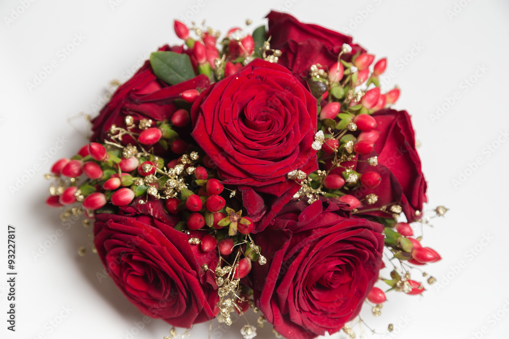 Roses decoration with hypericum for christmas on white backgroun Roses decoration with hypericum for christmas on white backgroun