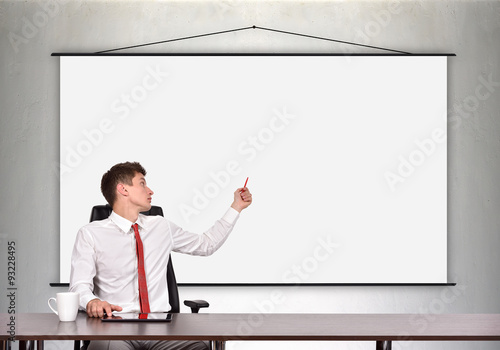 businessman showing a blank poster