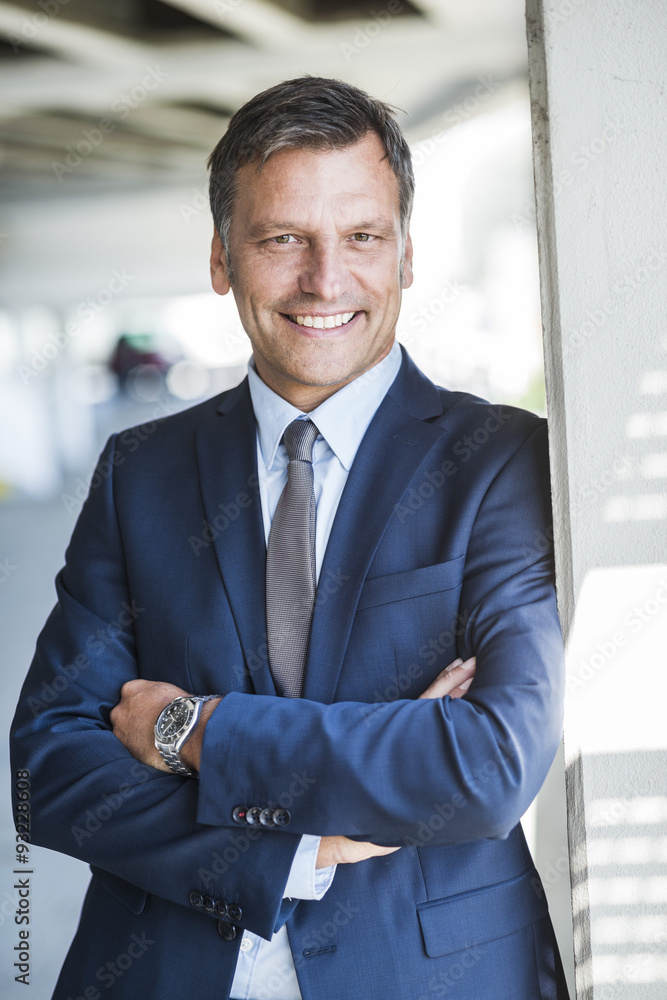 Mature businessman smiling confidently, portrait Mature businessman smiling confidently, portrait