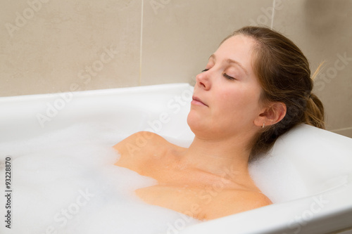 young woman enjoying a bath