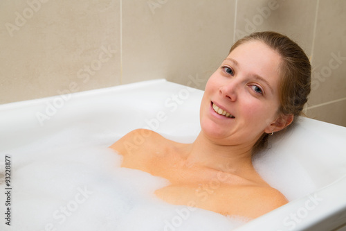 young woman enjoying a bath