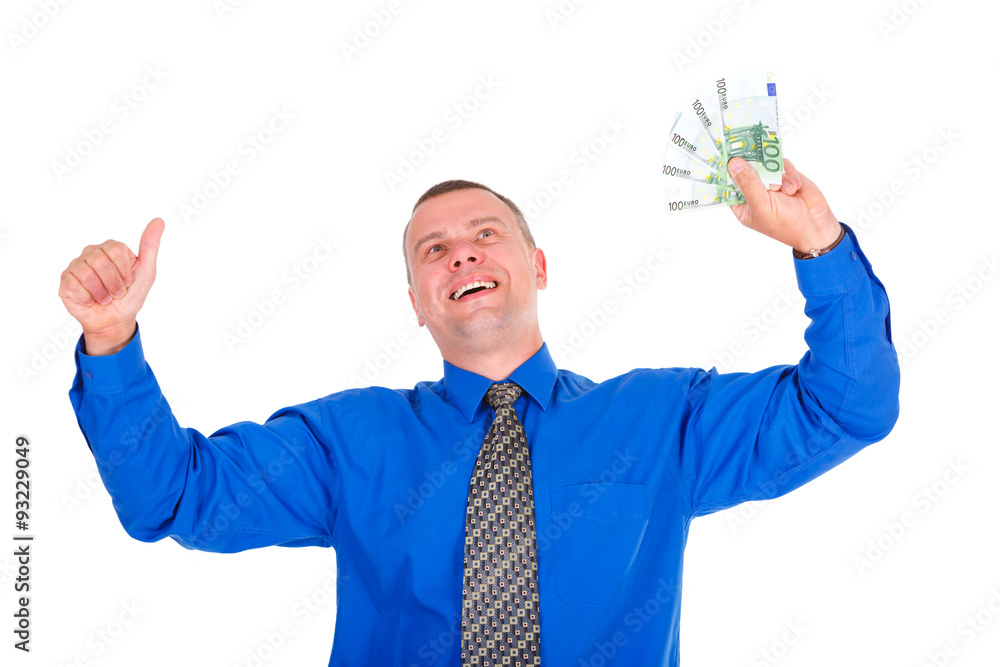 Portrait of happy, successful, lucky businessman in jeans, blue shirt and tie. Holding money euros banknotes and show gesture thumb up looking up. Isolated white background. Positive emotions Portrait of happy, successful, lucky businessman in jeans, blue shirt and tie. Holding money euros banknotes and show gesture thumb up looking up. Isolated white background. Positive emotions