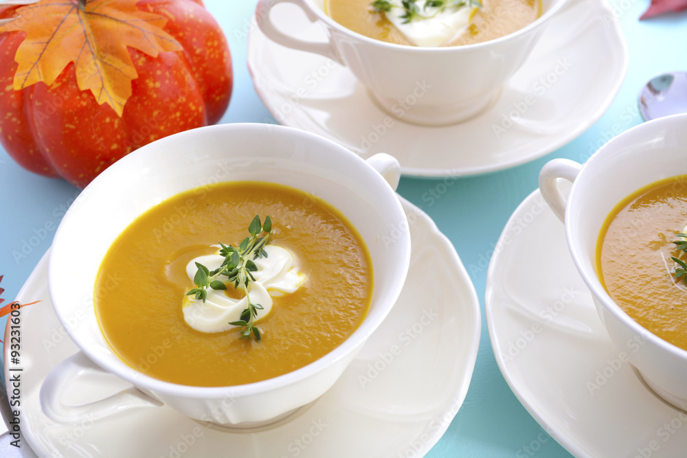 Thanksgiving table setting with pumpkin soup. Thanksgiving table setting with pumpkin soup.