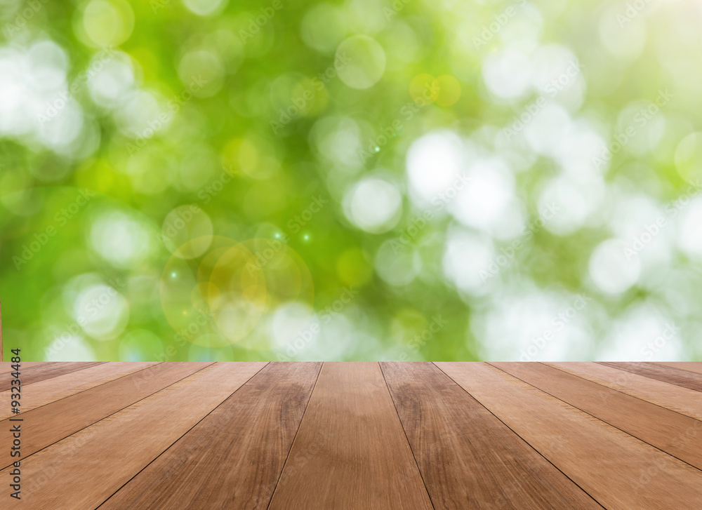 Nature bright spring background with sunlight bokeh and perspective wooden plank Nature bright spring background with sunlight bokeh and perspective wooden plank