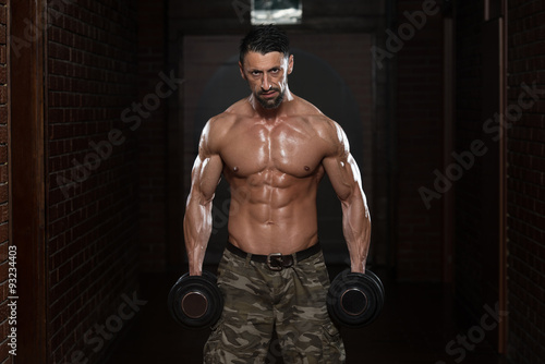 Healthy Man Doing Exercise For Biceps