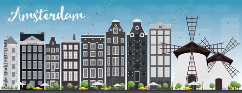 Amsterdam city skyline with grey buildings and blue sky