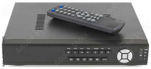 Security network digital video recorder and remote control isolated on white background.