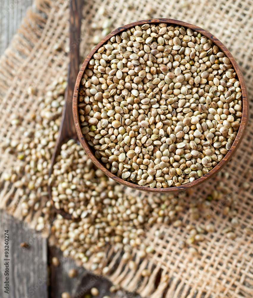 Fototapeta premium hemp seeds on wooden surface