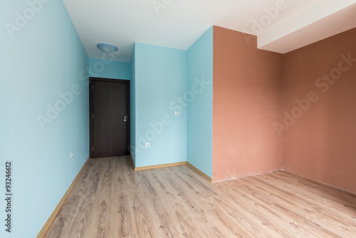 Empty blue room with windows and a door (includes clipping path)