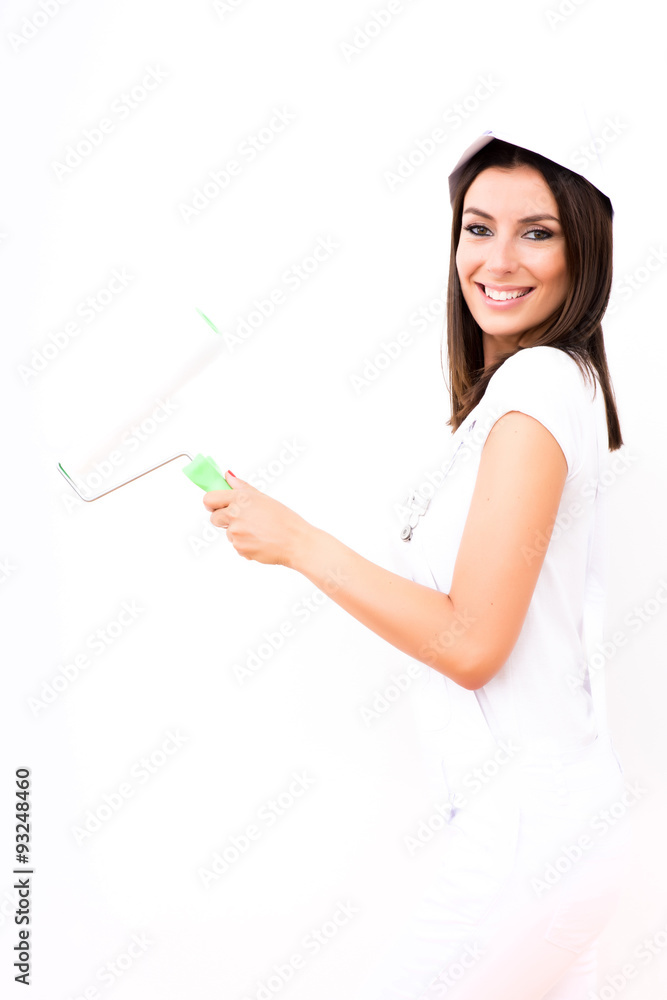 Beautiful young woman painting a Apartment Beautiful young woman painting a Apartment