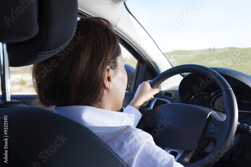 Businesswoman driving a sports car