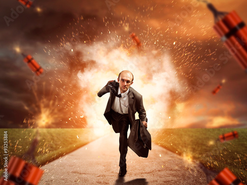 Fototapeta Man escaping from dynamite exploding
