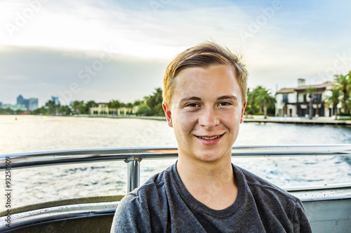 cute friendly boy on a boat