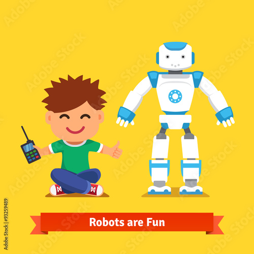 Little boy playing with remote controlled robot