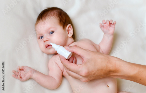newborn baby gets nose drops