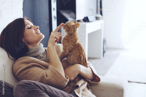 Woman resting with kitten