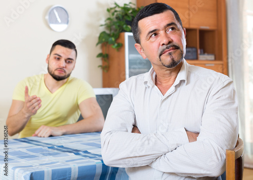 Two serious men having conflict