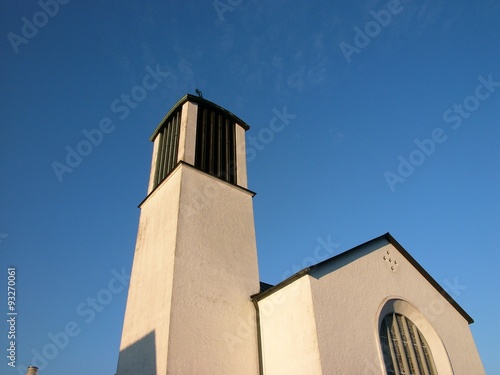 Die katholische Kirche St. Michael vor blauem Himmel im Sonnenschein in Oerlinghausen bei Bielefeld am Hermannsweg im Teutoburger Wald in Ostwestfalen-Lippe photo