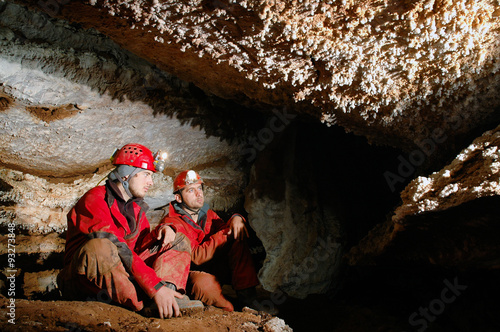 Spelunkers in a cave photo