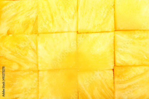 Fresh sliced pineapple cubes close up