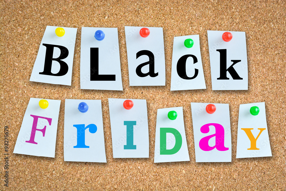 Black Friday sales text with wooden billboard and pins Black Friday sales text with wooden billboard and pins