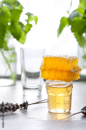 Honey variaty with bee's comb in a glass jurs photo