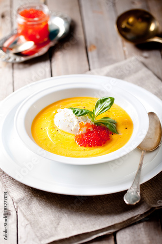 Pumpkin soup with cream and red salmon caviar