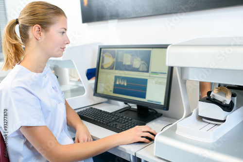 Female dentist using a computer