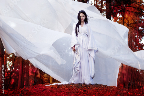фотографія Hero of Eastern philosophy. Asian woman in white kimono holding