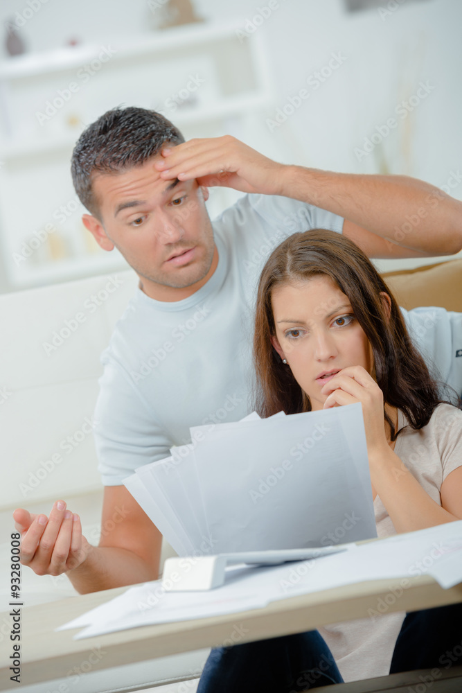 Couple arguing over bills Couple arguing over bills
