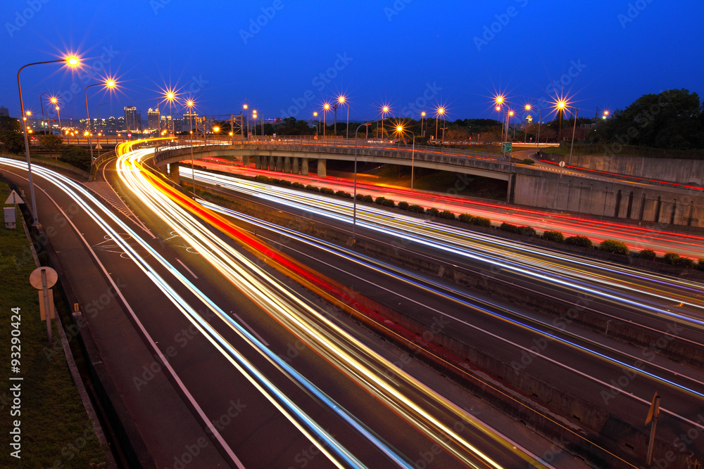 Car light trails on highway at night