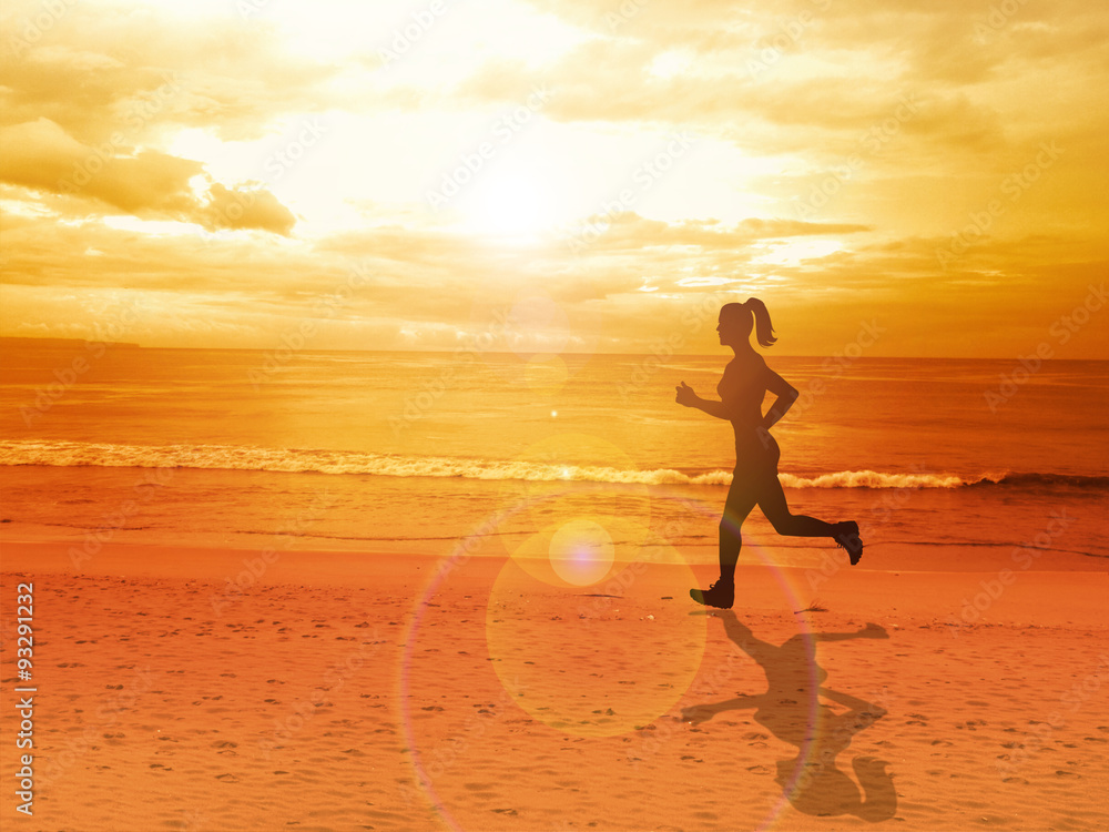 Woman jogging alone at beautiful sunset in the beach