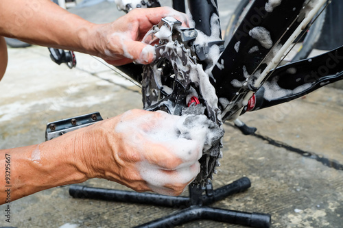Hands of mechanic fixing a bicycle
