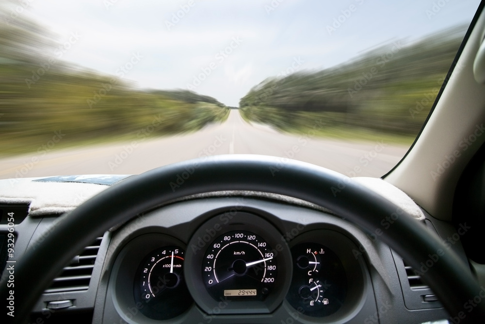 Car dashboard speeds while on the road. car driving fast . Car dashboard speeds while on the road. car driving fast .