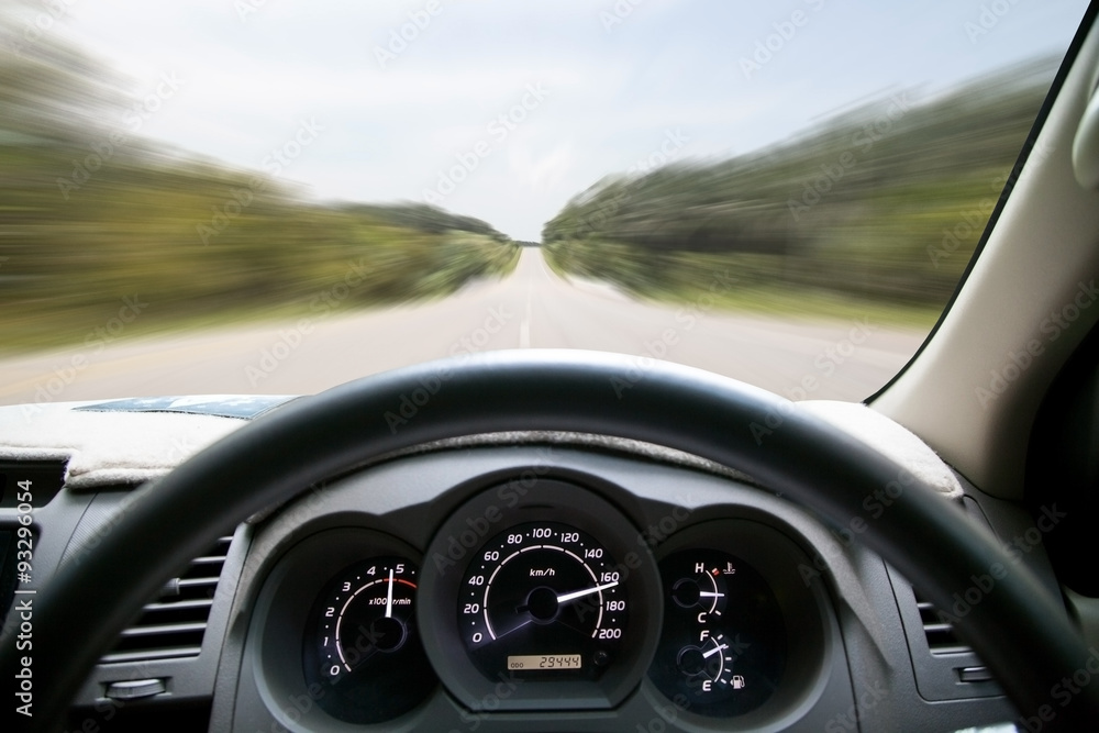 Car dashboard speeds while on the road. car driving fast .