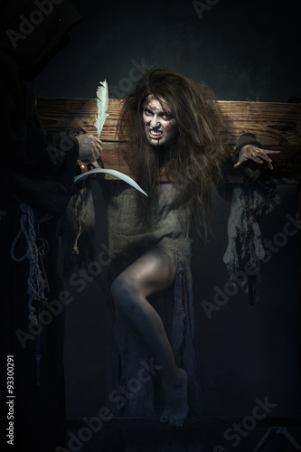 Halloween. The Middle Ages. Witch sign a verdict of the Inquisit