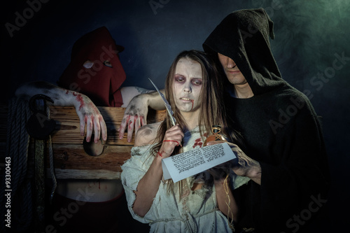 Halloween. The Middle Ages. Witch sign a verdict of the Inquisit photo