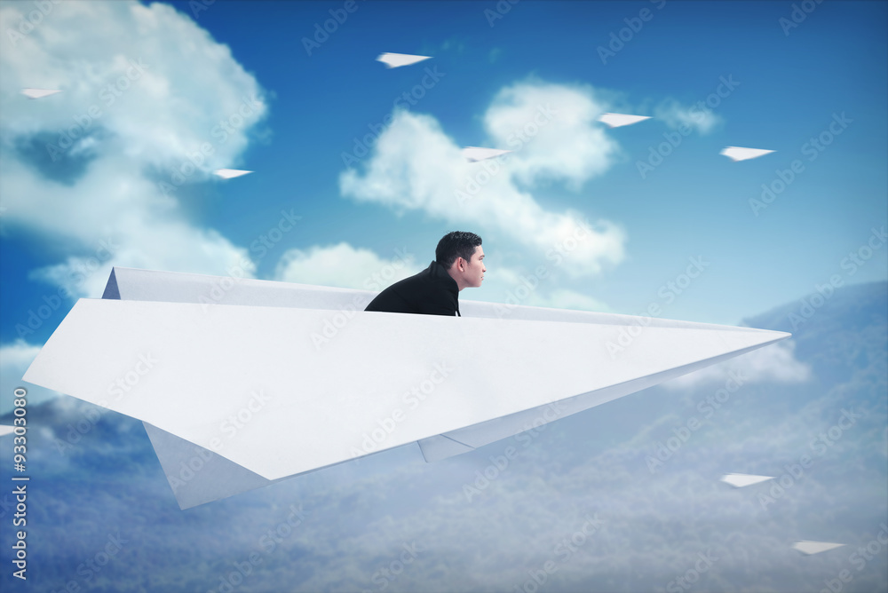 Asian business man flying with paper plane