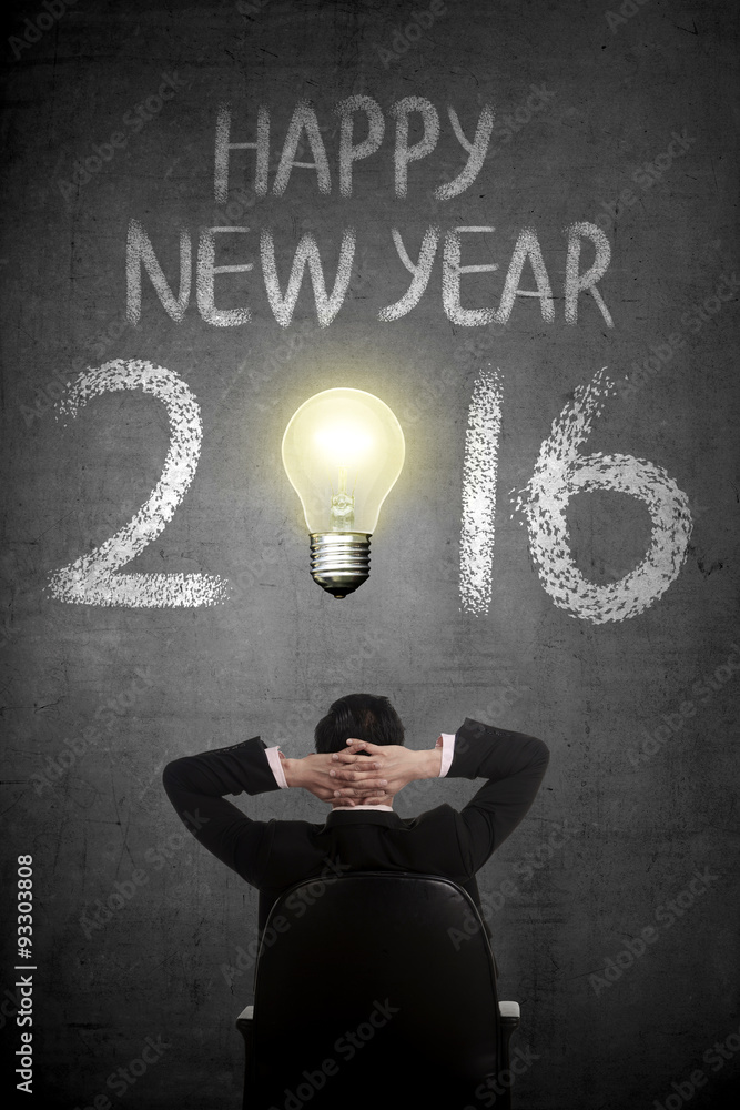 Fototapeta Business person looking Happy New Year 2016 writing